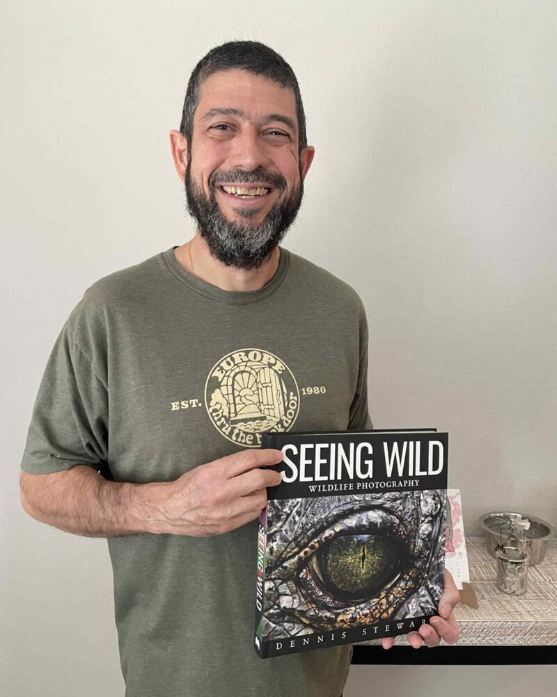 Smiling reader presenting Seeing Wild